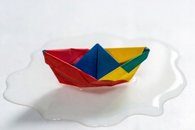 Colorful Origami Boat on Plate