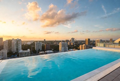 Infinity Pool Over City Skyline at Sunset