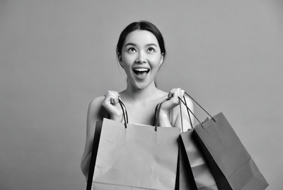 Asian woman holding shopping bags