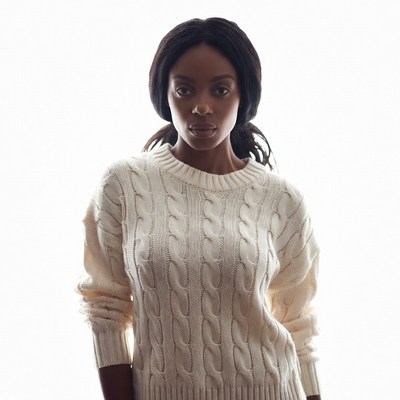 African-American woman in white sweater