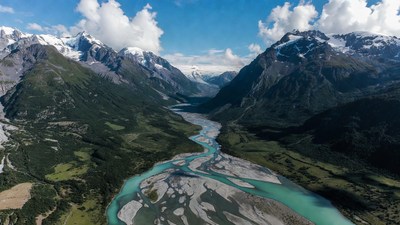 Aerial view of turquoise river in snowy mountains