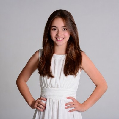 Smiling girl in white dress