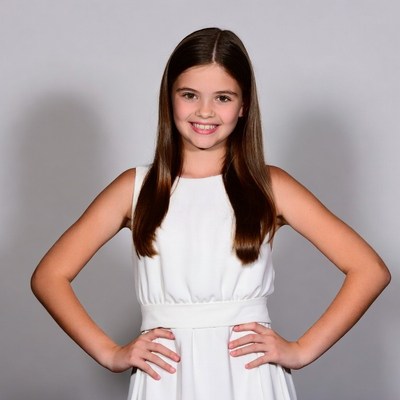 Smiling girl in white dress