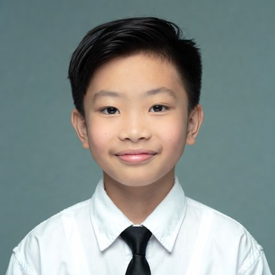 Asian boy in white shirt and tie
