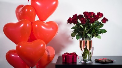 Red heart balloons and roses