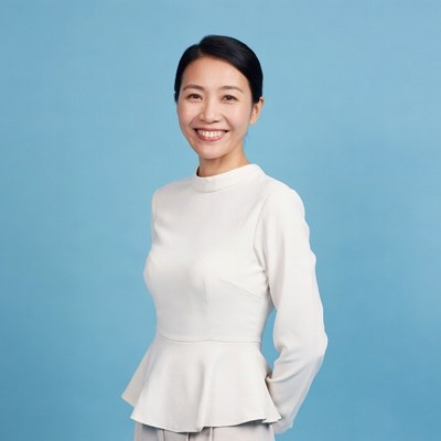 Asian woman smiling in white dress
