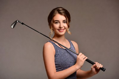 Girl holding golf club
