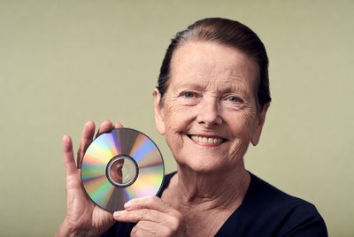 Elderly woman holding CD disc