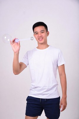 Asian man blowing giant bubble