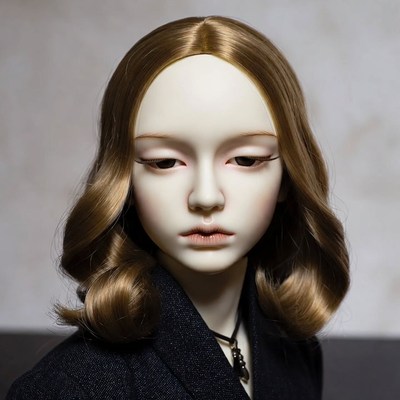Ball-jointed doll with wavy brown hair