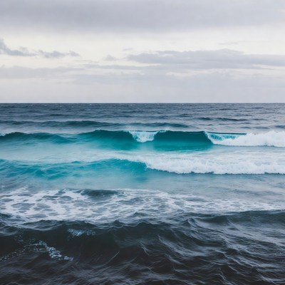 Ocean Waves Crashing Under Cloudy Sky