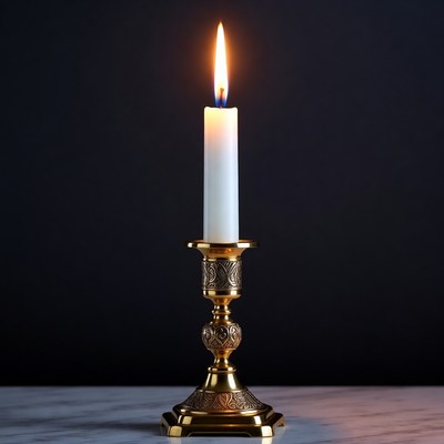 Lit Candle on Golden Candlestick