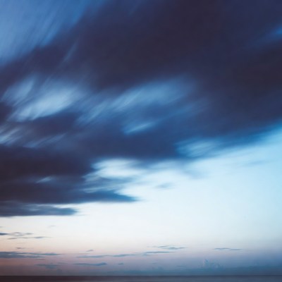 Dramatic Blue Swirling Clouds at Sunset