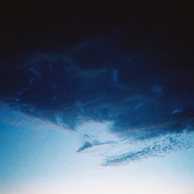 Dark Stormy Clouds in Blue Sky