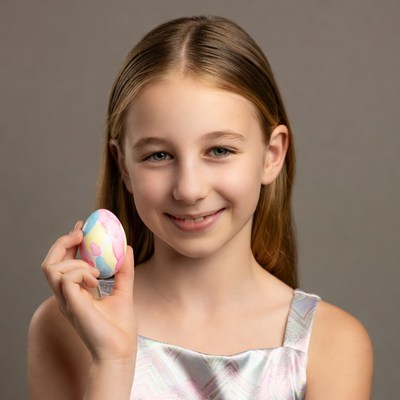 Girl holding colorful Easter egg