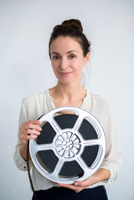 Woman holding film reel