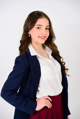 Teen girl in navy blazer smiling