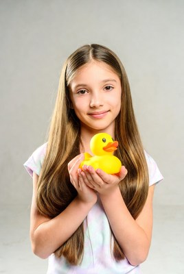 Girl holding yellow rubber duck