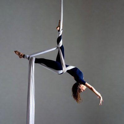 Woman performing aerial silk pose
