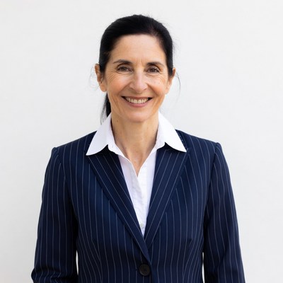Smiling woman in navy pinstripe suit