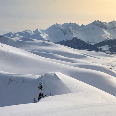 Snowy Mountain Peaks at Sunset