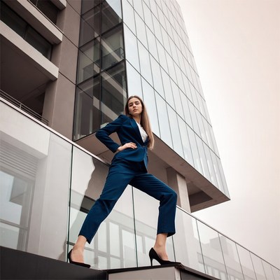 Woman in blue suit on balcony