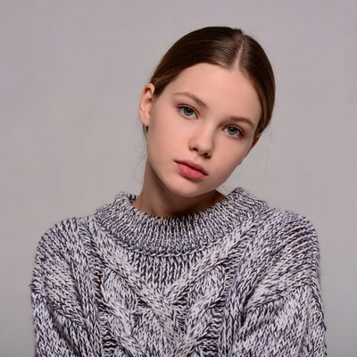 Teen girl in cable knit sweater