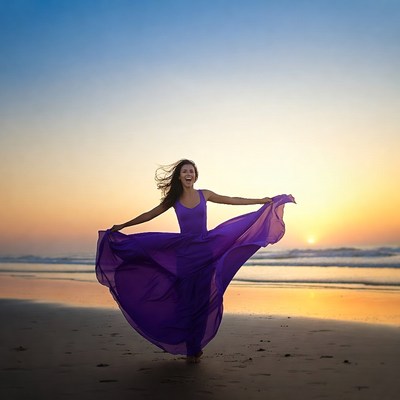 Woman twirling purple dress on beach sunset
