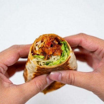 Hands Holding Open Burrito