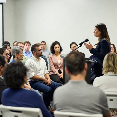 Woman speaking at business meeting