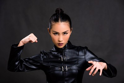 Asian woman striking martial arts pose