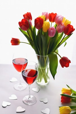 Red Wine Glasses and Colorful Tulips