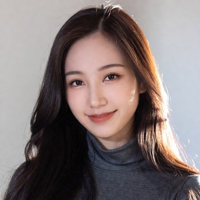 Asian woman smiling in turtleneck