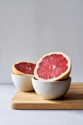 Sliced Grapefruits in White Bowls