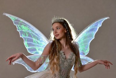 Woman in iridescent fairy wings