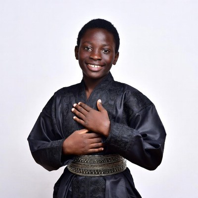 African boy in black embroidered robe