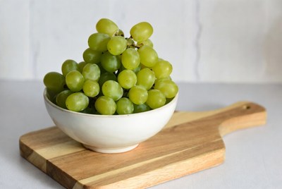 Green Grapes in Bowl on Cutting Board