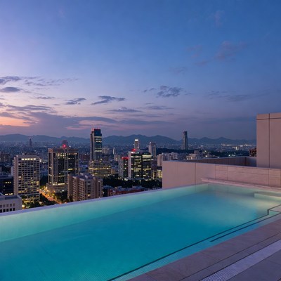 Infinity Pool Over City Skyline at Dusk