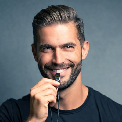 Man holding whistle smiling
