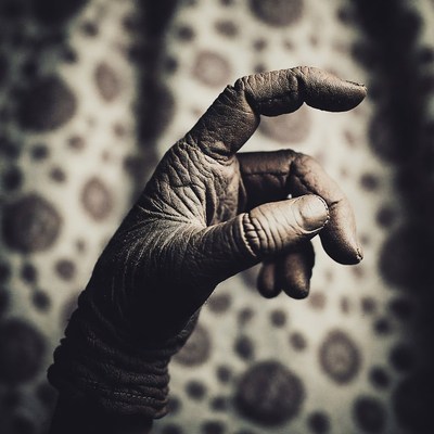 Wrinkled Leather Gloved Hand