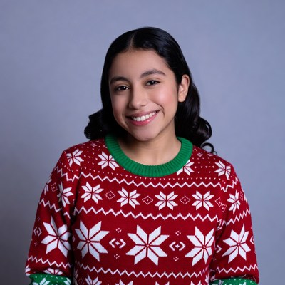 Latina girl smiling in Christmas sweater