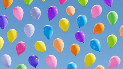Colorful Balloons Floating Against Blue Sky