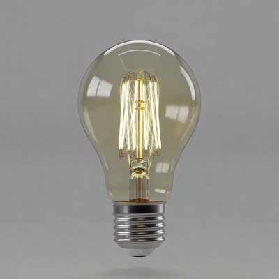 Glowing Edison Bulb on Gray Background