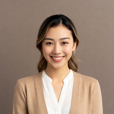 Asian woman smiling in beige cardigan