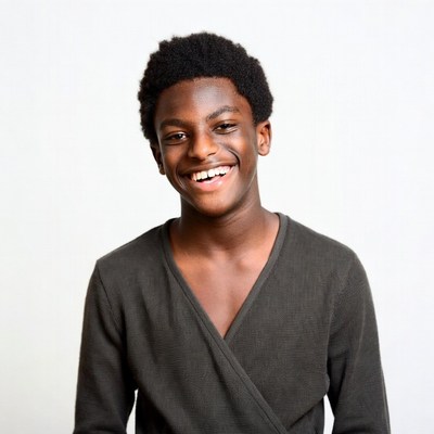 Smiling African-American boy in gray shirt