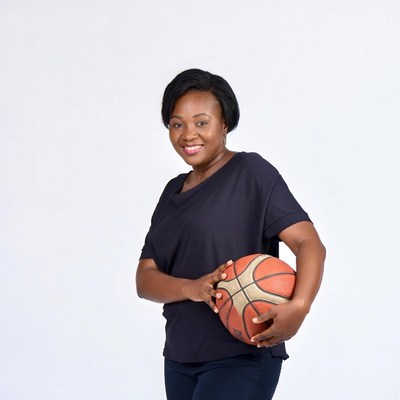 African-American woman holding basketball