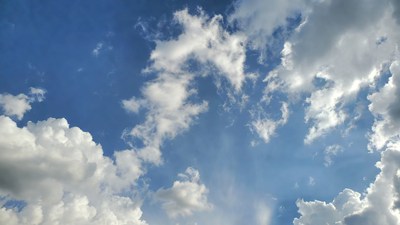 Fluffy Clouds in Blue Sky