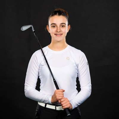 Young woman holding golf club