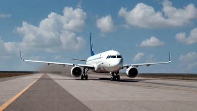 White Airplane Landing on Runway