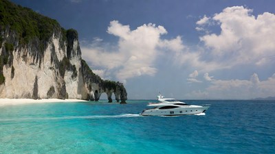 Luxury Yacht Cruising Turquoise Waters Cliffs